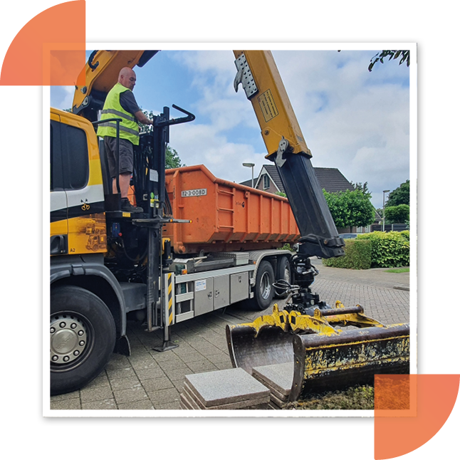 Foto van de tegeltaxi. Er worden tegels opgehaald